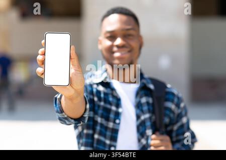 Afro man showing blank mobile phone screen Stock Photo