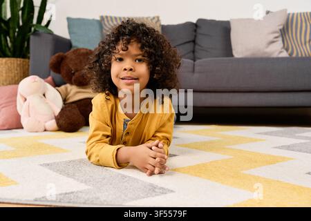 A cheerful African American boy enjoys playtime at home in a cozy living room Stock Photo