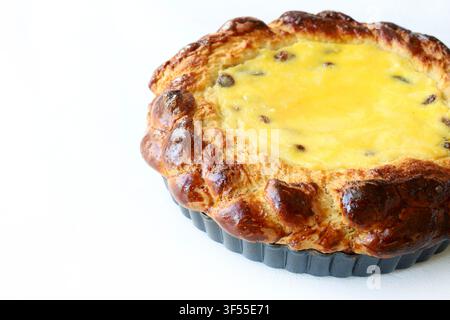 Traditional Romanian Easter cake Pasca with sweet cheese and raisin isolated on a white background. Authentic eastern European orthodox Easter traditi Stock Photo