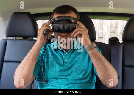 Man wearing gov goggles in the car horizontal photo Stock Photo