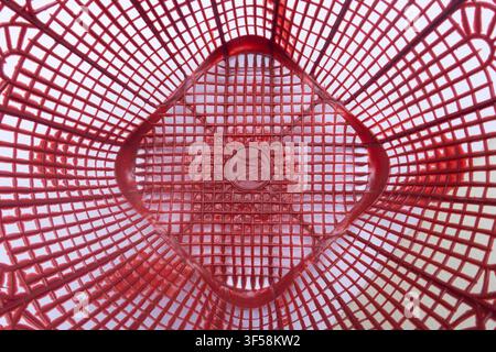 Red Plastic Basket Geometric Pattern Background, suitable for abstract background, texture, container detail Stock Photo