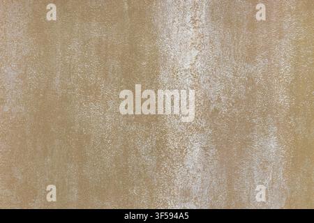 Close up of a beige textured wallcovering with a subtle mottled pattern. Stock Photo