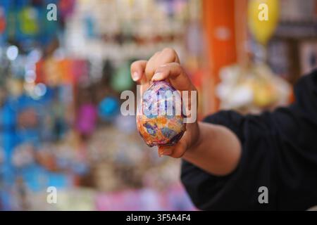 hand-painted or dyed Easter egg, likely decorated using a marble effect technique Stock Photo
