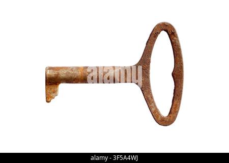 An antique iron key on a white background. Close-up of an old rusty key. Stock Photo