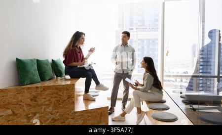 Group of diverse professional business team collaborating on corporate project Stock Photo