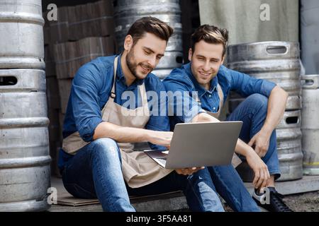 Online conference in workplace, modern device for factory and brewery Stock Photo