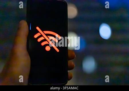 No Wi-Fi Connection Icon Displayed on Smartphone Screen at Night Stock Photo