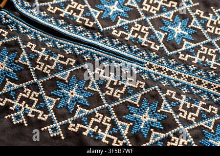 Ukrainian Vyshyvanka Men Embroidered Shirt Blue Geometric Ornaments. Embroidery background. Stock Photo