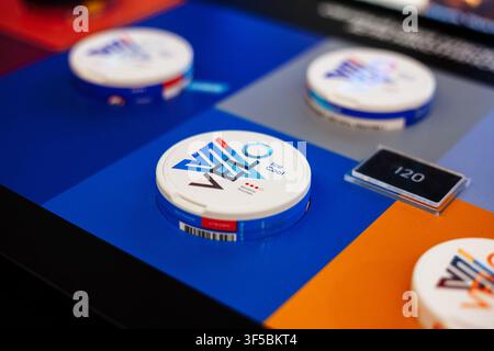 Kremenchuk, Ukraine - July 9, 2021: Round White Nicotine Pouch Containers of glo Displayed On A Colorful Multi Colored Grid Surface Stock Photo