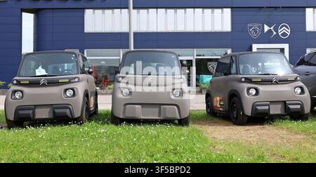 Tavagnacco, Italy. May 3, 2025. Three Citroen Ami on display in front of the official dealership. Stock Photo