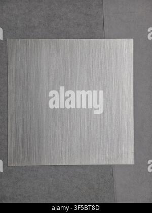 Metallic sheet static display, in indoor floor, with metallic sheet, from a top down perspective, with gray, silver accents, and neutral mood, showing Stock Photo
