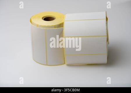 Rolls of white labels isolated. Labels for direct thermal or thermal transfer printing. Blank sticky label roll for thermal transfer printing pirce cr Stock Photo