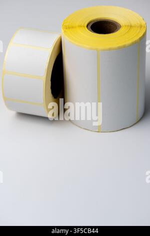 Rolls of white labels isolated. Labels for direct thermal or thermal transfer printing. Blank sticky label roll for thermal transfer printing pirce cr Stock Photo