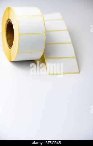 Rolls of white labels isolated. Labels for direct thermal or thermal transfer printing. Blank sticky label roll for thermal transfer printing pirce cr Stock Photo