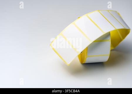 Rolls of white labels isolated. Labels for direct thermal or thermal transfer printing. Blank sticky label roll for thermal transfer printing pirce cr Stock Photo