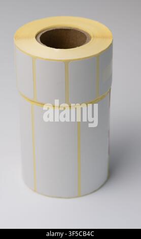 Rolls of white labels isolated. Labels for direct thermal or thermal transfer printing. Blank sticky label roll for thermal transfer printing pirce cr Stock Photo
