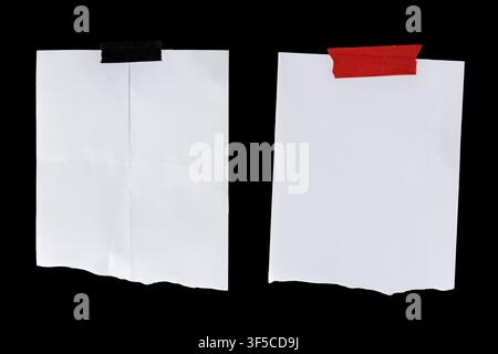 Two blank torn paper note reminder with adhesive tape isolated on black background template mockup Stock Photo