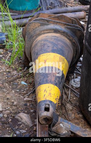 An old cone abandoned on the ground, which was once used for protection, is now polluting the environment in the Amazon rainforest, Brazil. Stock Photo