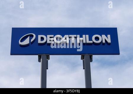 Grancia, Ticino, Switzerland - 15th June 2026: Low angle view of the new Decathlon blue brand logo sign with orbit symbol on store exterior in Lugano Stock Photo