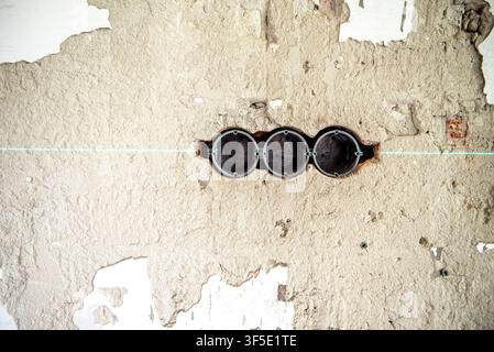 Exposed electrical wires and unfinished wall outlet boxes during residential renovation. Electrical installation in progress before plastering and fin Stock Photo