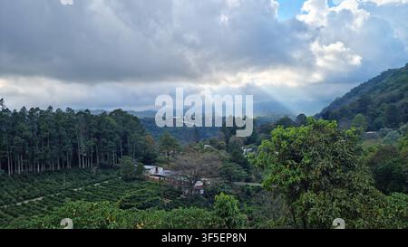 Lush Mountain View with Clouds and Sunbeams in the Highlands of Panama Stock Photo