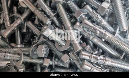 Texture of bolts and nuts in bulk. Stock Photo