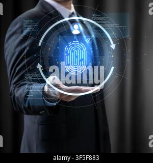 Businessman interacting with a futuristic digital hologram of a fingerprint scan for cybersecurity, biometric authentication, and advanced data protec Stock Photo