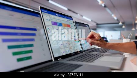 Mature Woman Working On Laptop To Manage Sales And Track Leads. Stock Photo