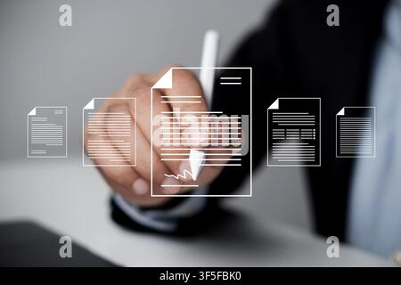 Businessman uses digital pen to sign virtual digital contact. E-signing on an e-document, electronic signature. Managing virtual documents efficiently Stock Photo