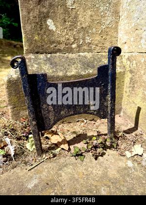 An old iron boot scraper outside a church in a village in England, U.K. Stock Photo