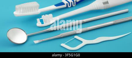 Dental care tools and products on blue background Stock Photo
