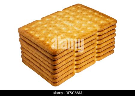 Stacked crispy crackers showing uniform perforations and golden baked texture Stock Photo