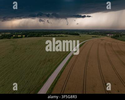 Massive Rain Shaft Beneath a Severe Thunderstorm over Agricultural Fields in Rural Latvia Stock Photo