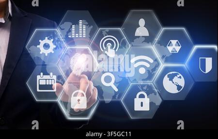 Business Data Management. Businessman Choosing Fingerprint Icon On Digital Screen For Access Stock Photo