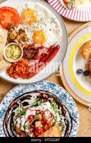 Variety of gourmet breakfast and brunch dishes on a wooden table Stock Photo