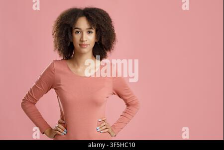 Serious facial expression, beautiful curly haired model Stock Photo