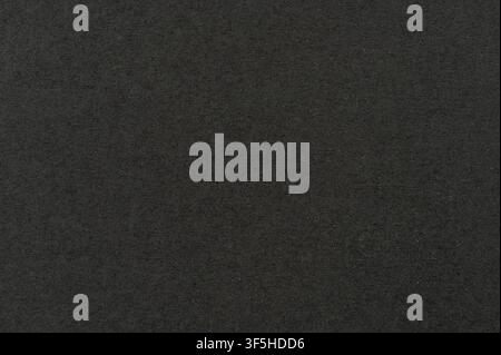Black paper with dust spots texture background macro close up view Stock Photo