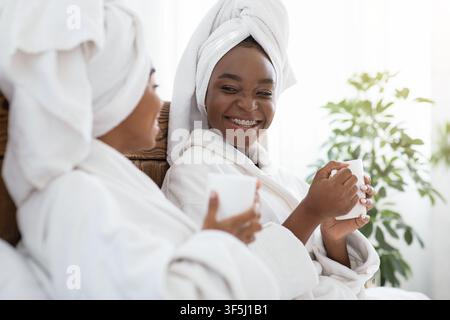 Closeup of two african women enjoying spa day Stock Photo