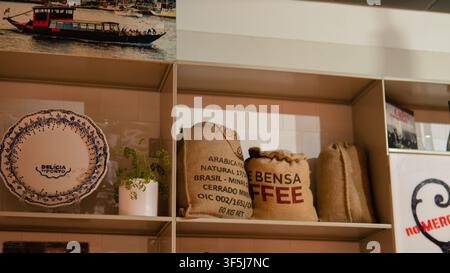Burlap Coffee Sacks from Brazil and Ethiopia Beside a Blue Azulejo Plate on a Café Shelf in Mercado do Bolhão, Porto, Portugal — Coffee Culture Stock Photo