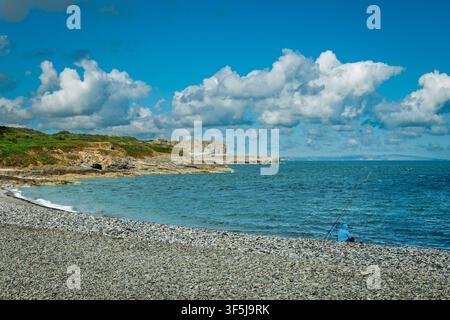 The pebbly beach at Penmon point on the Isle of Anglesey in North Wales. Stock Photo