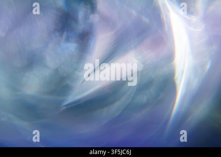 Ethereal abstract background with soft blue light refraction, translucent flowing shapes, iridescent highlights and defocused bokeh. Dreamy luminous t Stock Photo