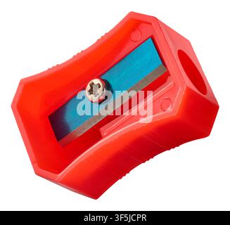 red plastic pencil sharpener isolated white background, metal blade and screw stationery supply, macro close-up mock-up template Stock Photo