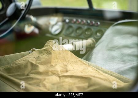 Interior of a vintage Soviet-era military ambulance with stretcher and dashboard controls. Stock Photo