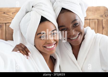 Pretty african women having ladies day at home Stock Photo