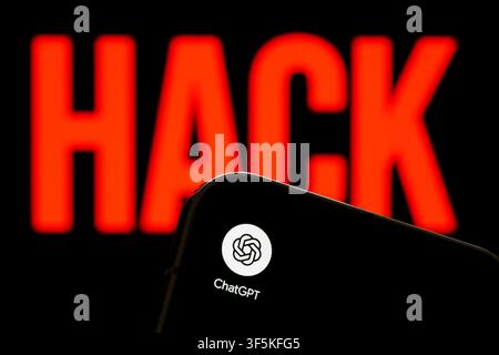ChatGPT app logo shown on a smartphone against a red HACK warning in an artificial intelligence cybersecurity concept. Stafford, United Kingdom, Augus Stock Photo