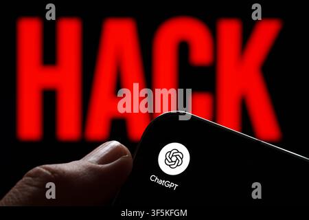 ChatGPT app logo shown on a smartphone held in hand against a red HACK warning in an AI security concept. Stafford, United Kingdom, August 2, 2026. Stock Photo