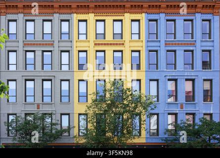 Facades of old brick buildings painted in pastel colors Stock Photo