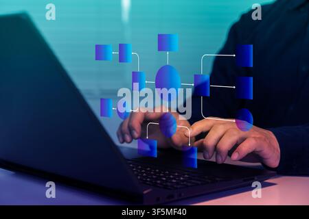 Professional using a laptop with a digital flowchart overlay, representing workflow automation, process mapping, system design, data management, proje Stock Photo