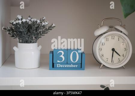 Decorative clock and calendar display on a shelf Stock Photo