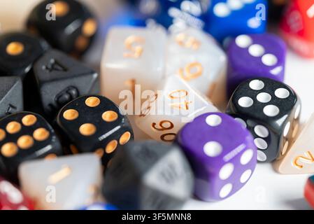 Collection of black white purple and blue gaming dice for board games and strategy Stock Photo